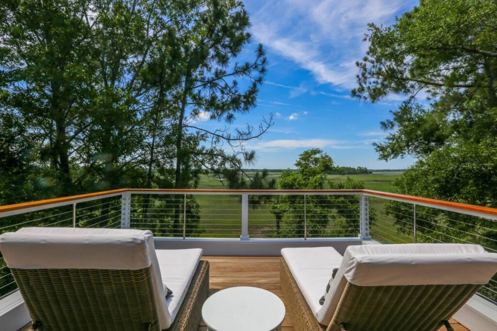 Loungers on a deck facing the marsh of Kiawah Island, SC