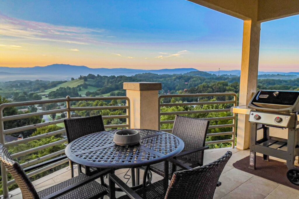 Photo of Pigeon Forge patio with metal table and chairs overlooking valley views