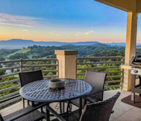 Photo of Pigeon Forge patio with metal table and chairs overlooking valley views
