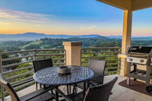 Photo of Pigeon Forge patio with metal table and chairs overlooking valley views