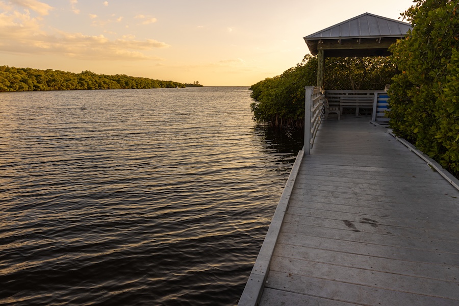 A boardwalk along the waterway of Cape Coral, Florida at dusk
