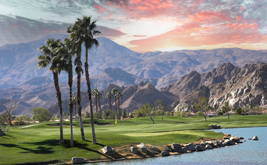 Photo of a golf course with palm trees in La Quinta, CA near the mountains
